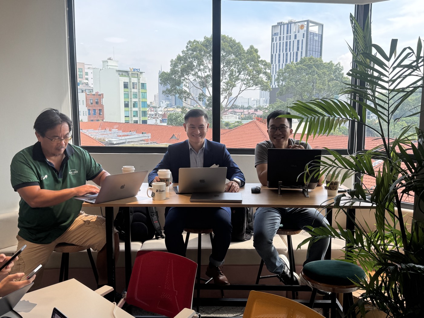 A company team and an engineer building at one table